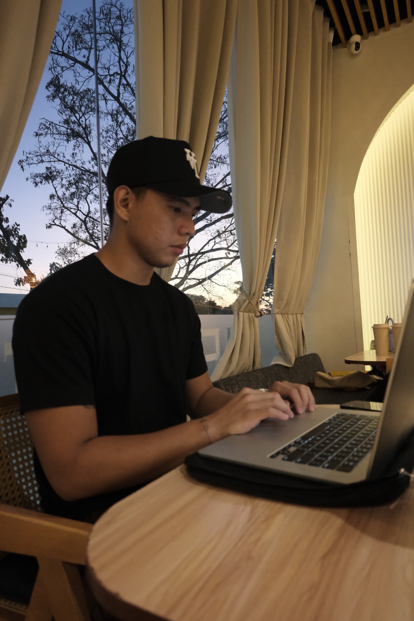 Ejay Perez working on his laptop